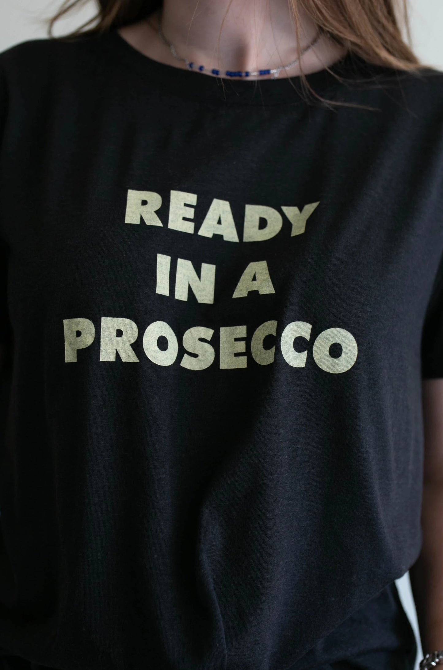 ready in a prosecco tee